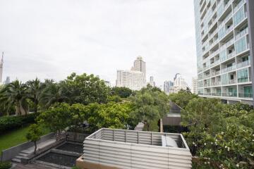 View of surroundings from the property with greenery and neighboring buildings