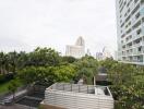 View of surroundings from the property with greenery and neighboring buildings