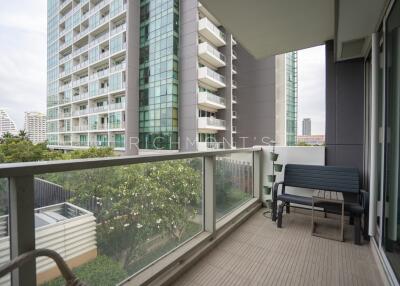 Balcony view of modern building with outdoor seating