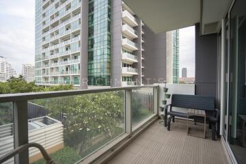 Balcony view of modern building with outdoor seating