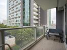 Balcony view of modern building with outdoor seating