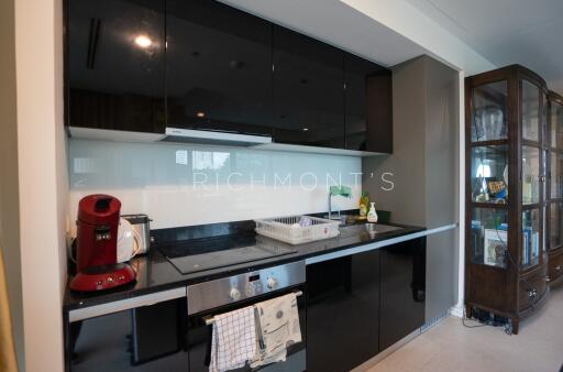 Modern kitchen with sleek black cabinets and appliances