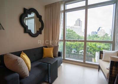 Cozy living room with large window and city view