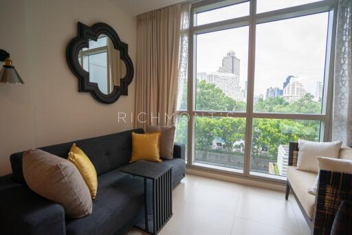 Cozy living room with large window and city view