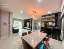 Modern dining area with marble table and stylish lighting