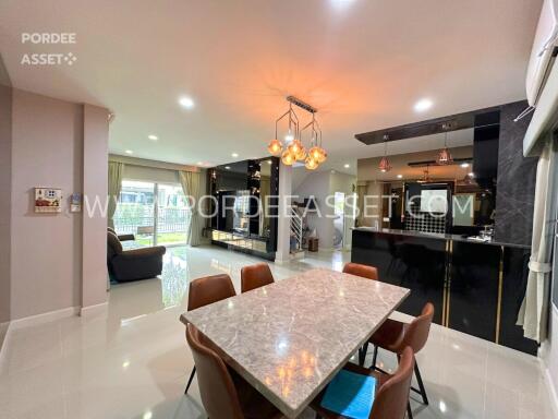 Modern dining area with marble table and stylish lighting