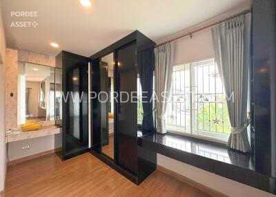 Bedroom with mirrored wardrobe and large window