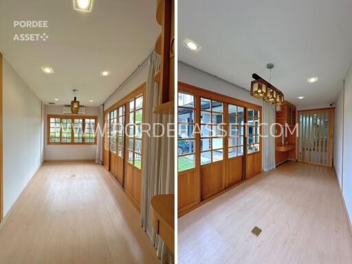 Interior view featuring a well-lit wooden-floored room with large windows and glass doors