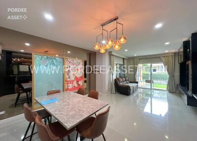 Modern living room with dining area and large windows