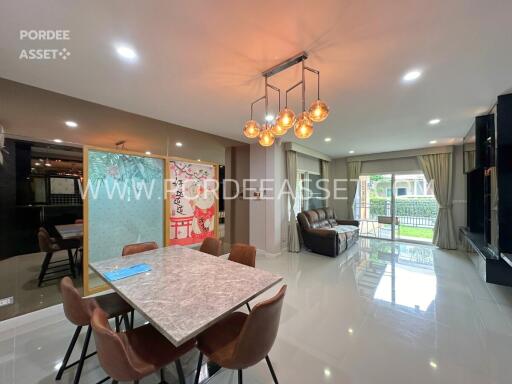 Modern living room with dining area and large windows