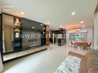 Spacious modern living area with dining table and large windows