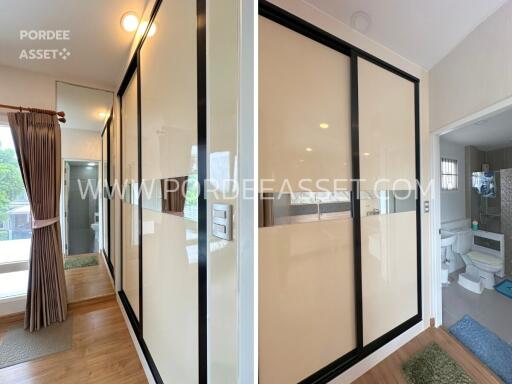 Modern bedroom with large sliding closets and a view into the bathroom