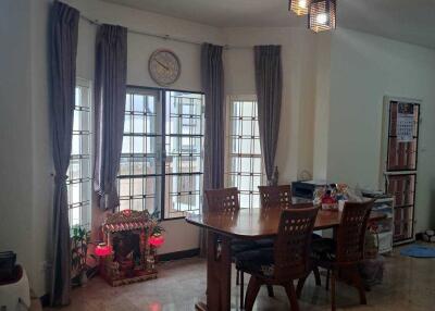 Dining room with large windows and modern lighting