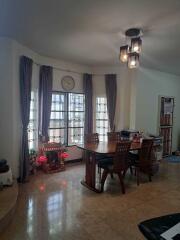 Dining room with large windows and modern lighting