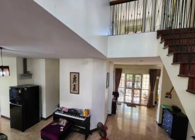 Modern living area with stairs and natural light