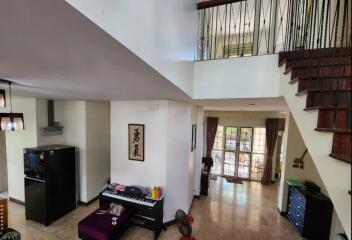 Modern living area with stairs and natural light