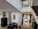 Modern living area with stairs and natural light