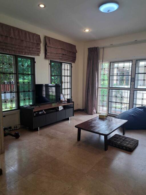 Cozy living room with large windows and natural light