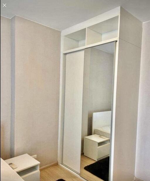 Bedroom with mirrored sliding door wardrobe