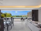 Modern living room and dining area with expansive outdoor view