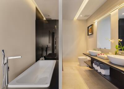 Modern bathroom with bathtub and double sink vanity