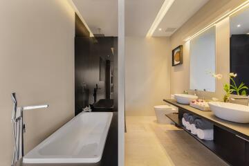 Modern bathroom with bathtub and double sink vanity