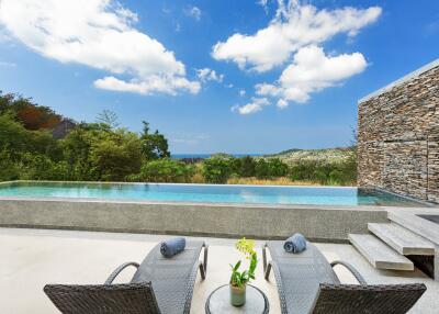 Outdoor area with pool and lounge chairs