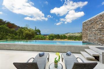 Outdoor area with pool and lounge chairs