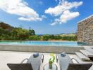 Outdoor area with pool and lounge chairs