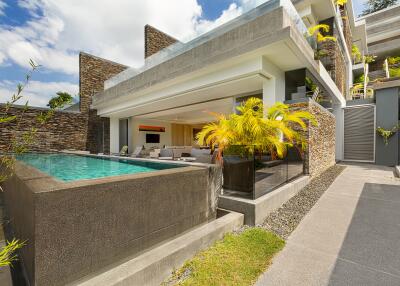 Modern exterior view of a luxurious home with a pool