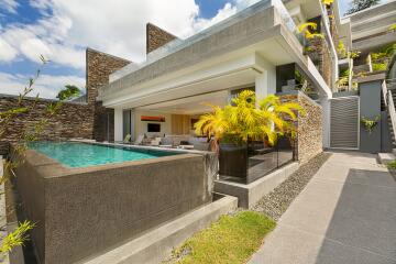 Modern exterior view of a luxurious home with a pool