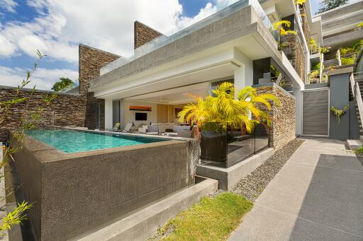 Modern exterior view of a luxurious home with a pool