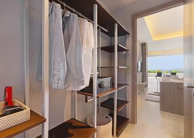 Spacious walk-in closet with open hanging space and shelving