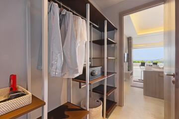 Spacious walk-in closet with open hanging space and shelving