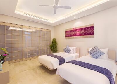 Modern bedroom with two single beds and contemporary decor