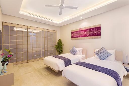 Modern bedroom with two single beds and contemporary decor