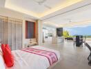 Modern and spacious bedroom with open living area and ocean view