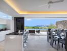 Modern open-plan kitchen and dining area with a scenic outdoor view