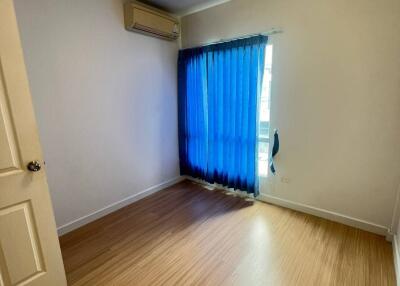 Empty bedroom with blue curtains