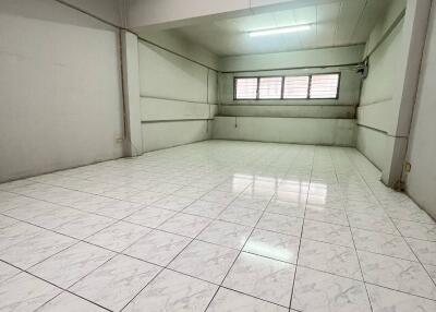 Spacious empty room with tiled floor