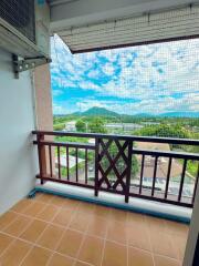 Spacious balcony with scenic mountain view