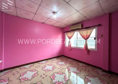 Brightly colored bedroom with patterned tiles