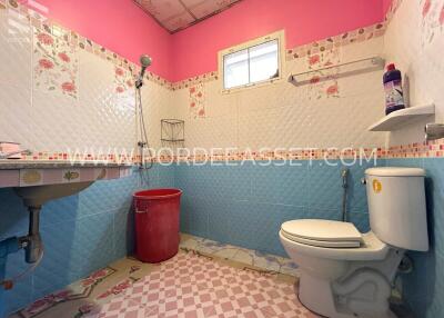 Colorful bathroom with shower and toilet