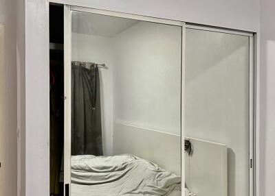 Bedroom with mirrored closet doors