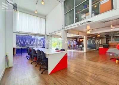 Modern open-plan office space with desks and chairs