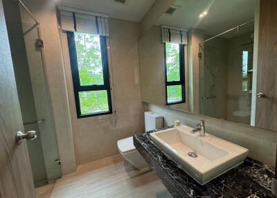 Modern bathroom with large windows and sleek design