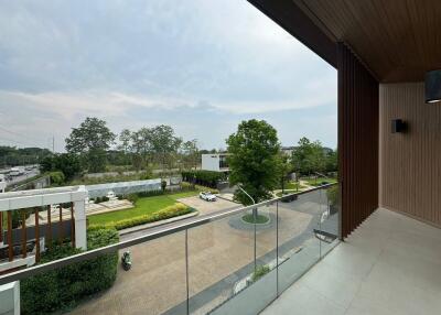 View from balcony overlooking a residential neighborhood