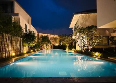 Beautifully lit swimming pool at night