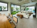 Modern living room with large windows and garden view