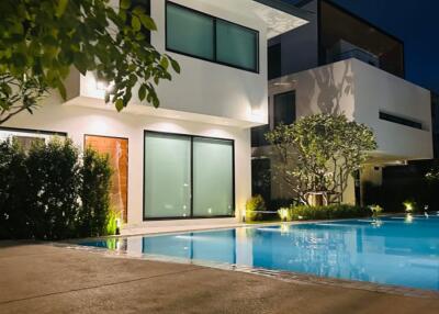 Modern house with pool at night